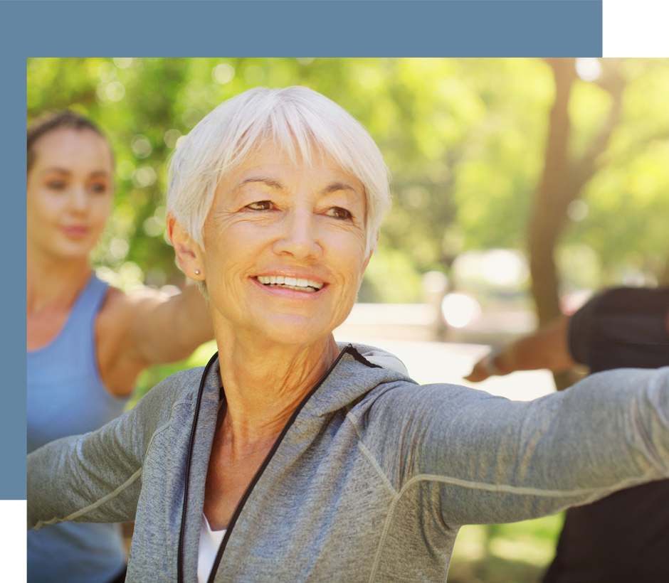 Smiling woman stretching without pain from her acupuncture treatments